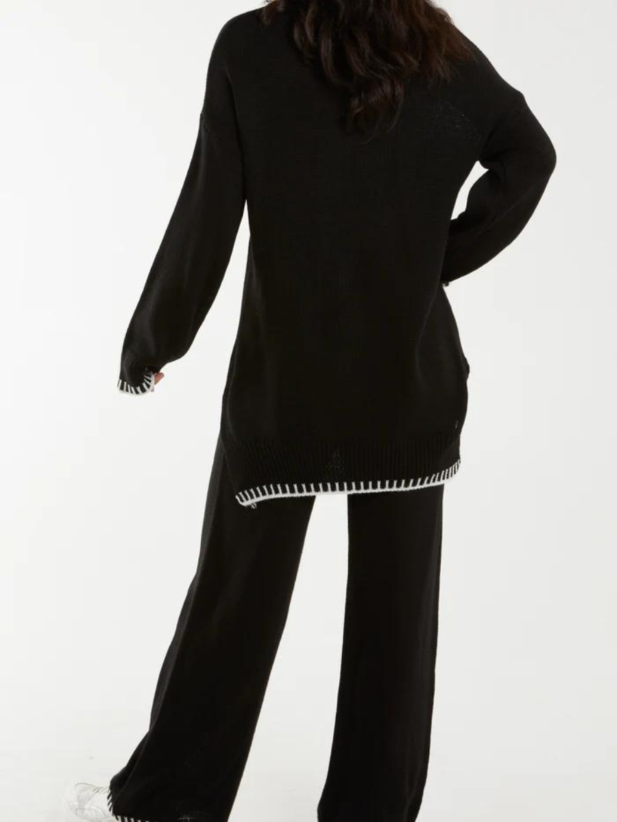 Knitted cable coordination law with sewn hem