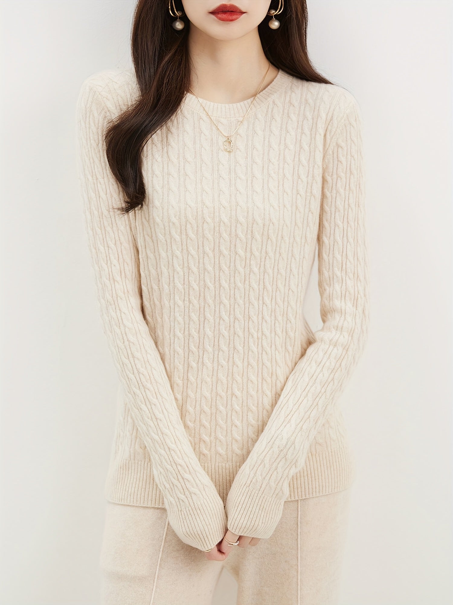 Cable knitted wool sweater with round neck