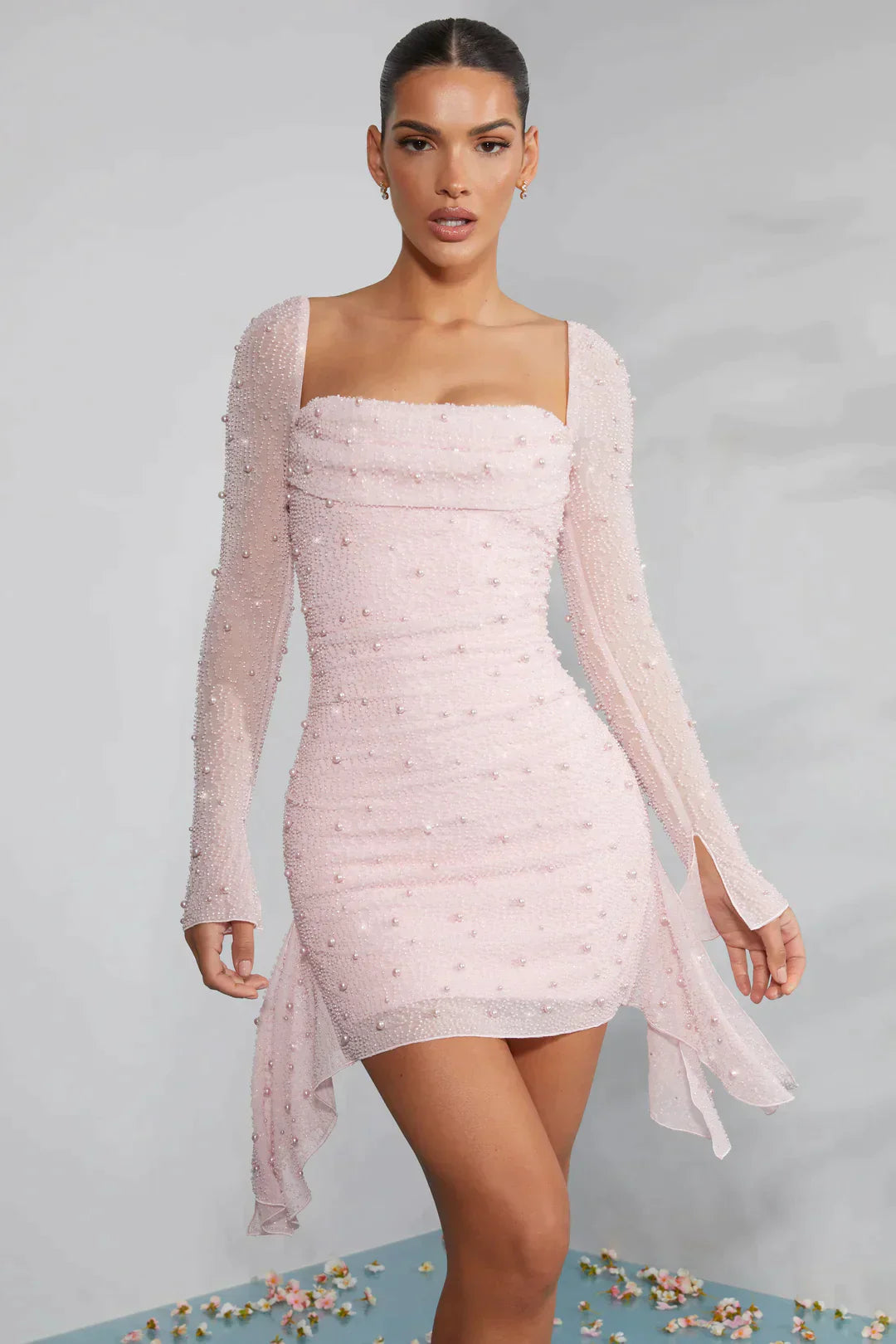 Mini dress with long sleeves embellished with draped neckline in light pink