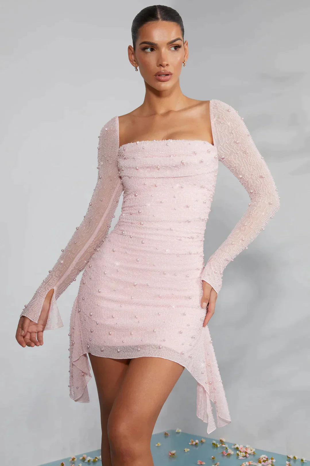 Mini dress with long sleeves embellished with draped neckline in light pink