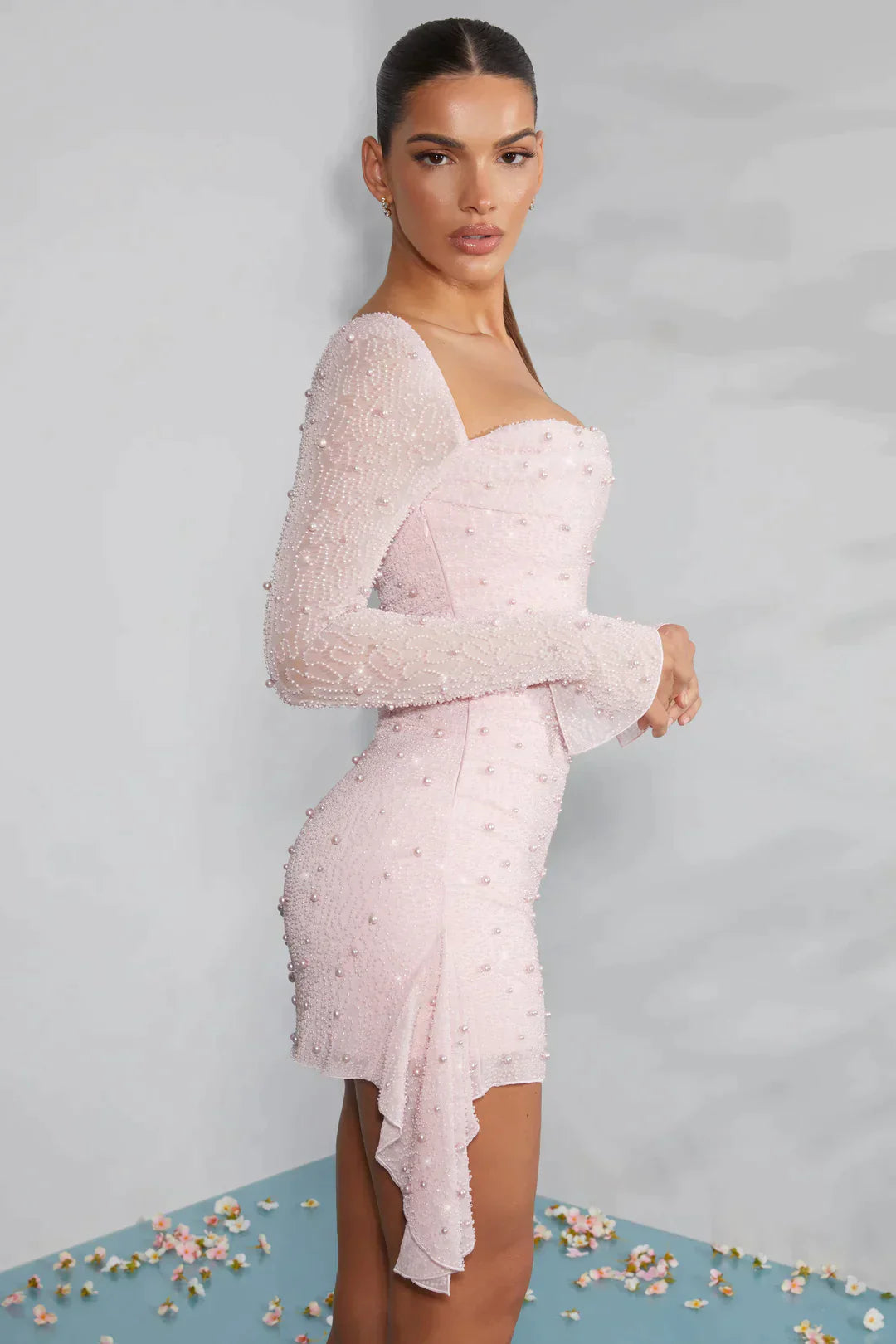 Mini dress with long sleeves embellished with draped neckline in light pink