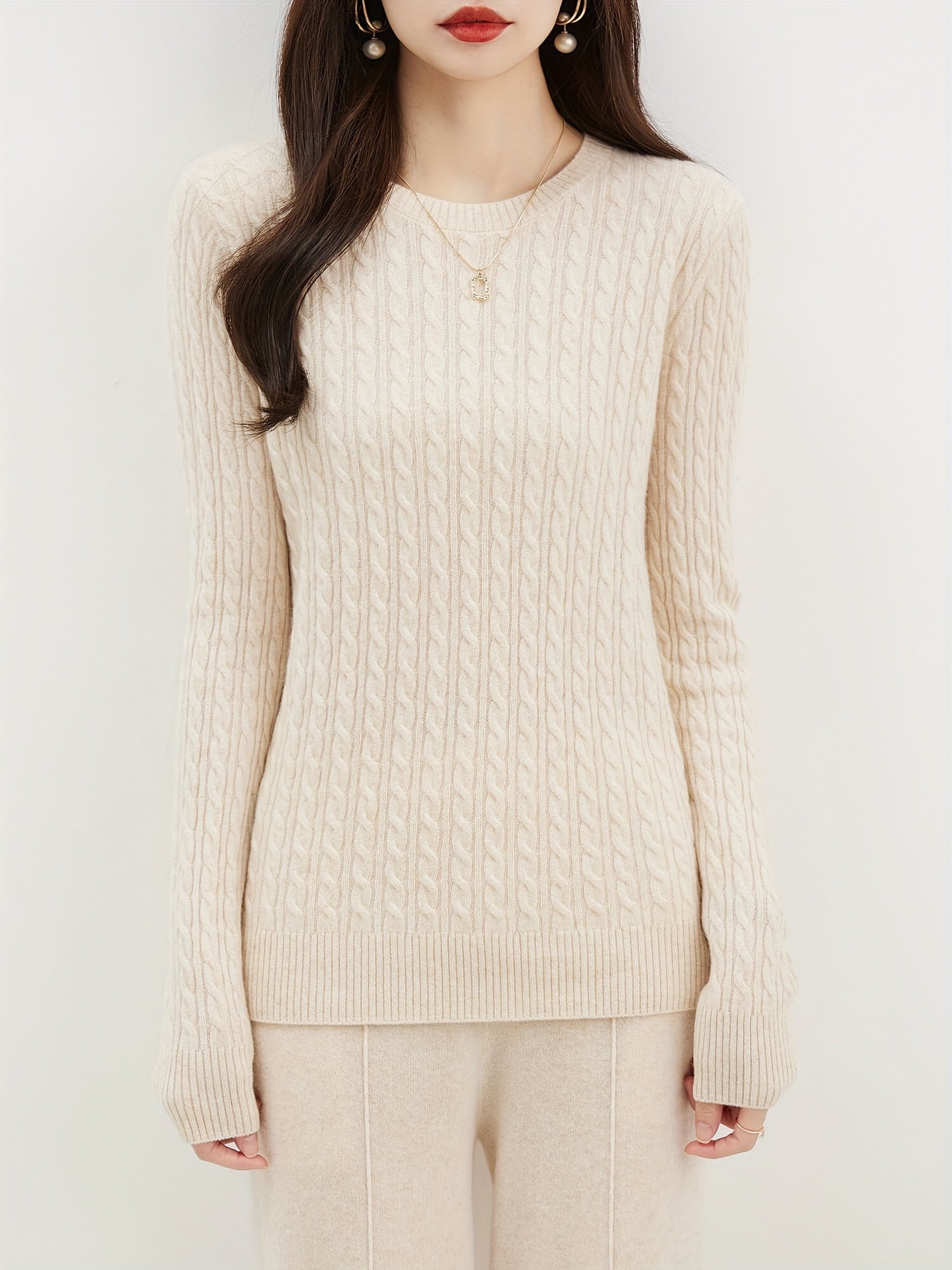 Cable knitted wool sweater with round neck