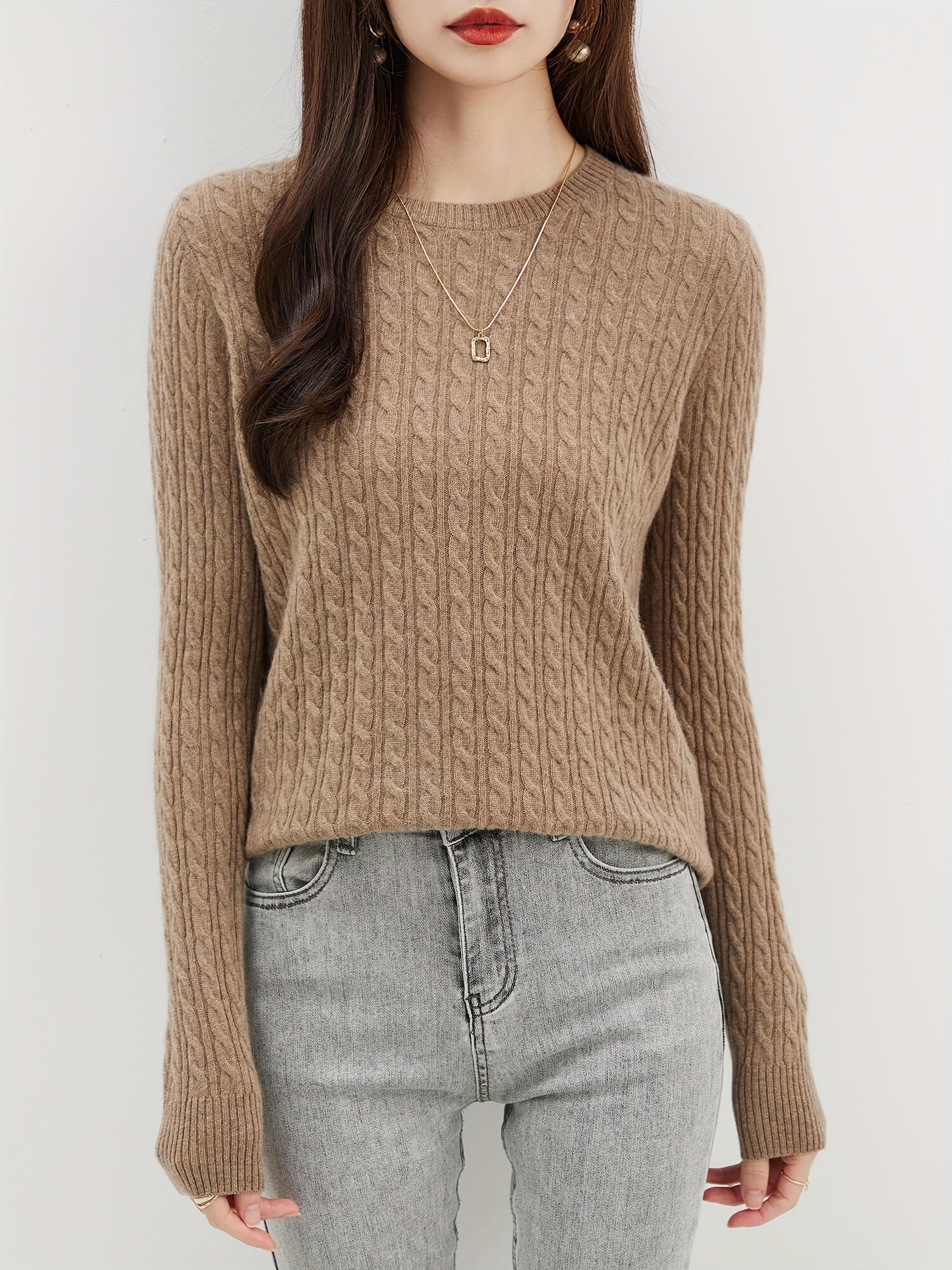 Cable knitted wool sweater with round neck