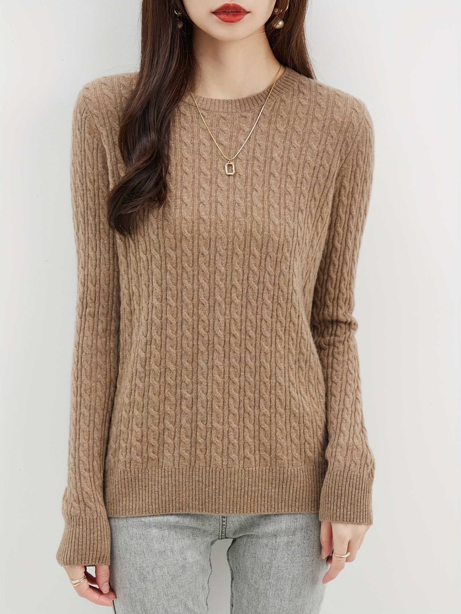 Cable knitted wool sweater with round neck