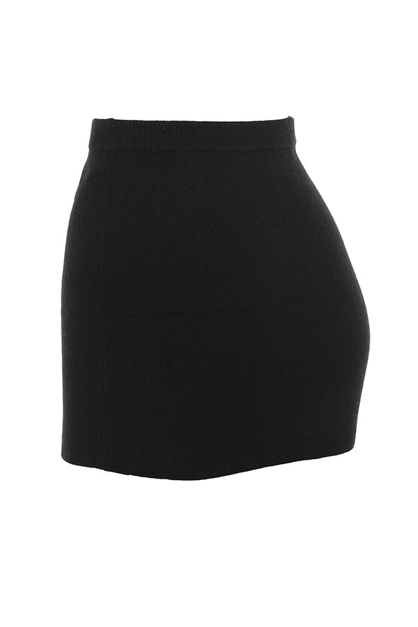 Black cardigan with faux fur trim and cashmere mini skirt
