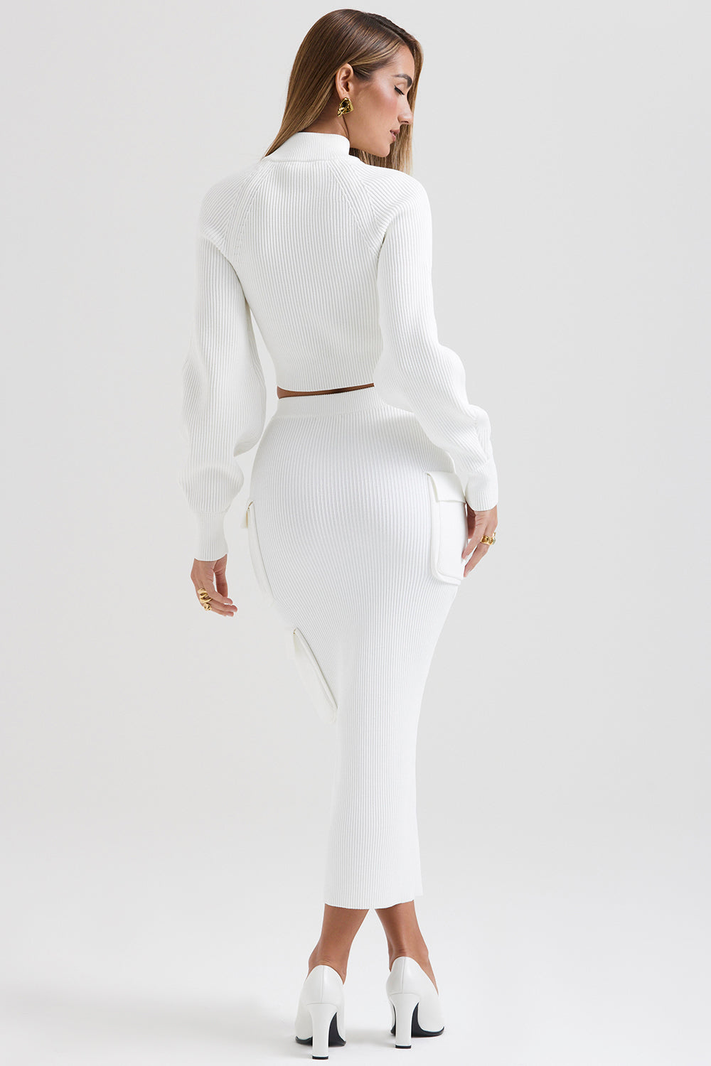 White ribbed sweater with balloon sleeves and cargo skirt