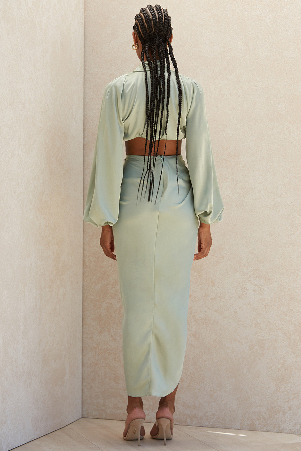 Deep-cut blouson top in silky satin with draped skirt