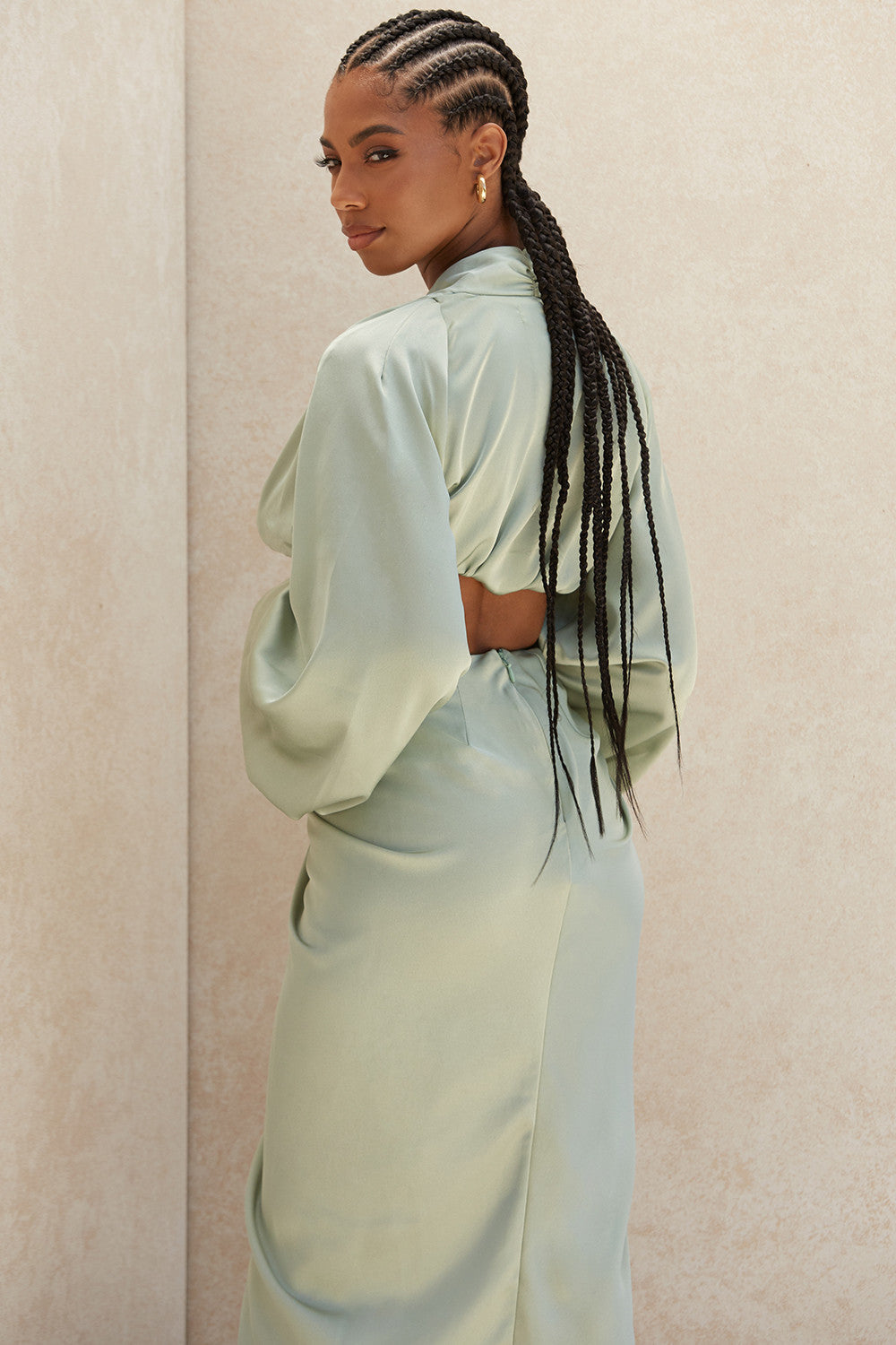 Deep-cut blouson top in silky satin with draped skirt