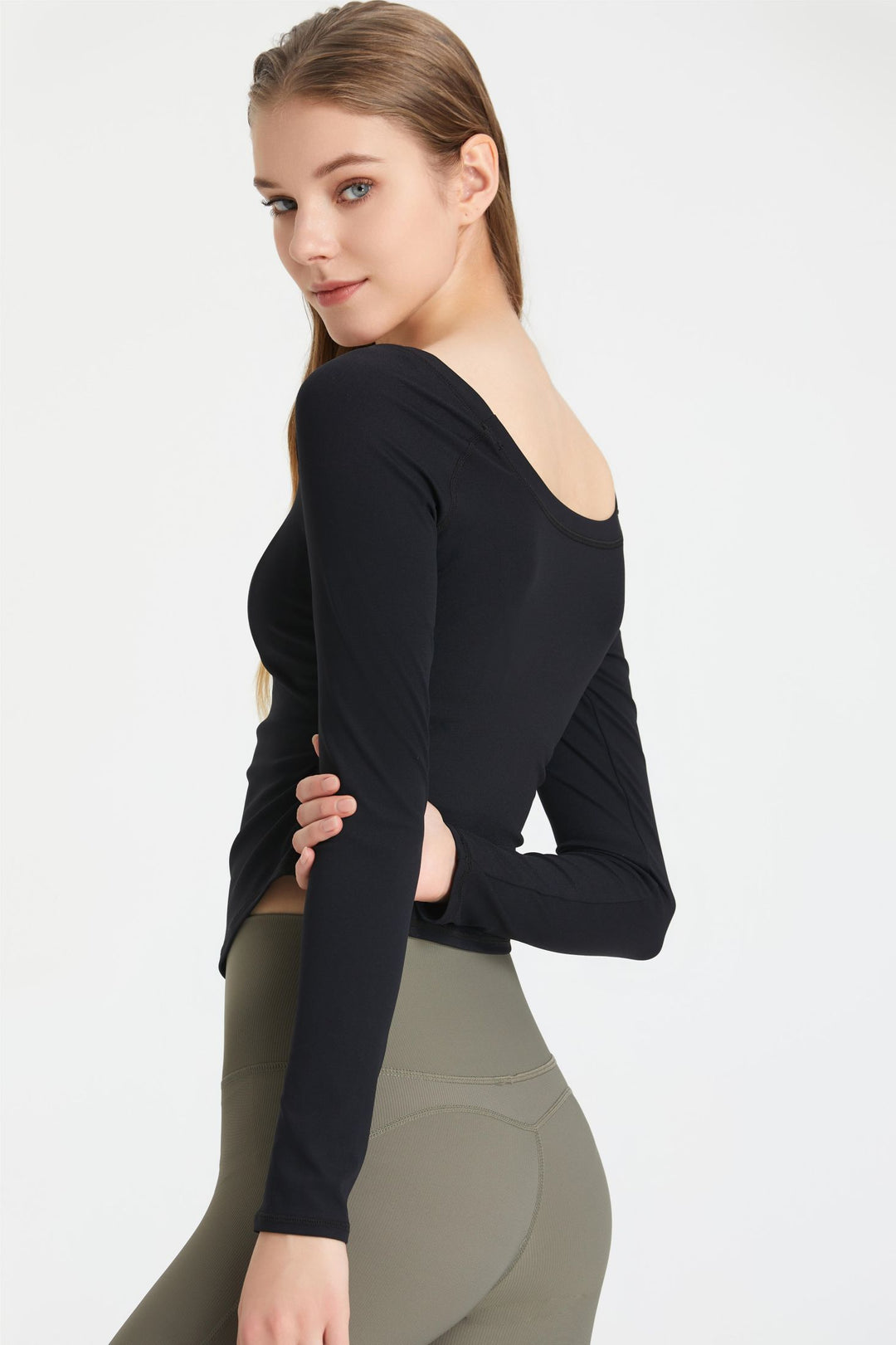 Top with long sleeves and ruffles on the sides
