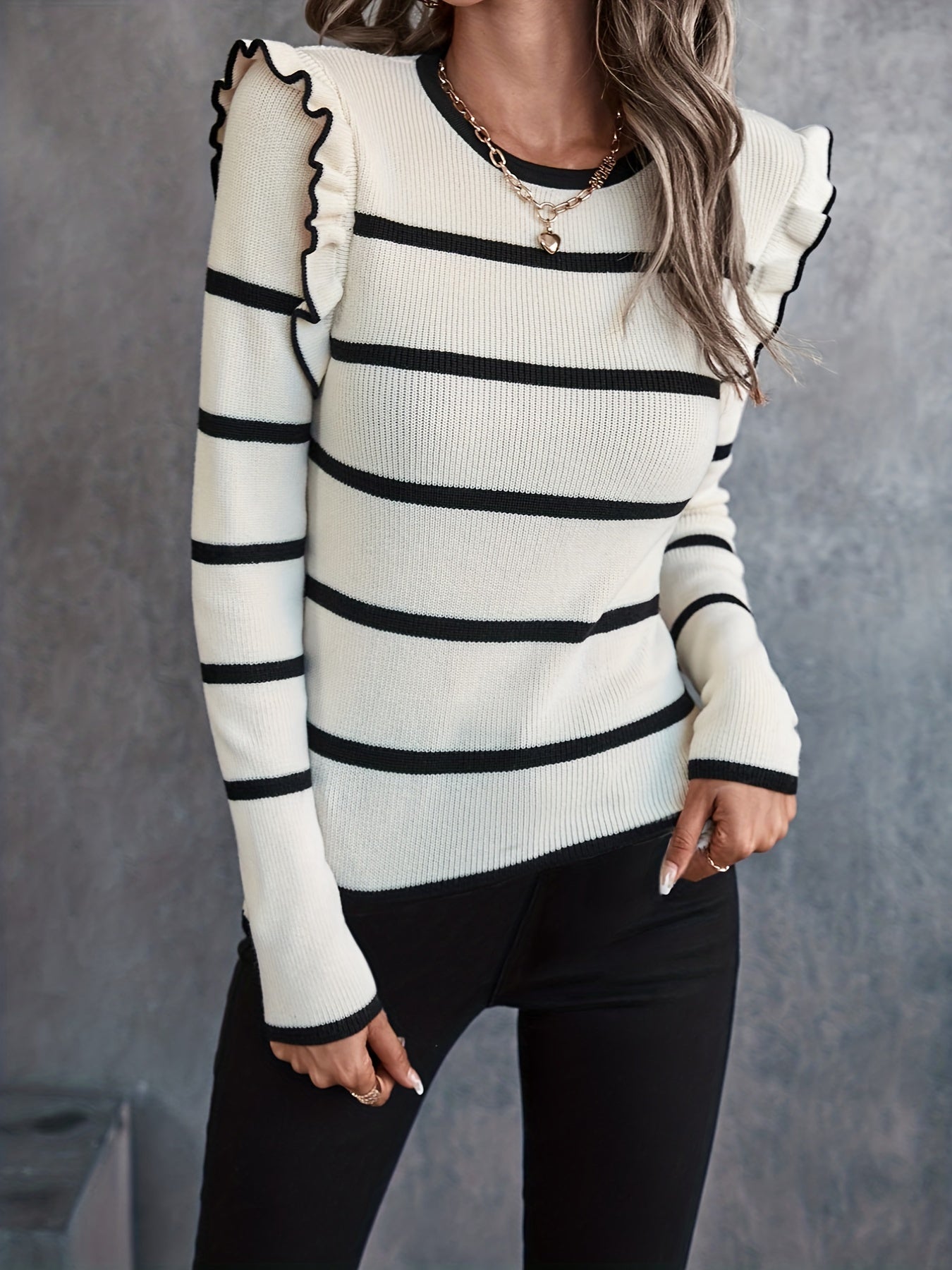 Striped sweater with round neck in black and white