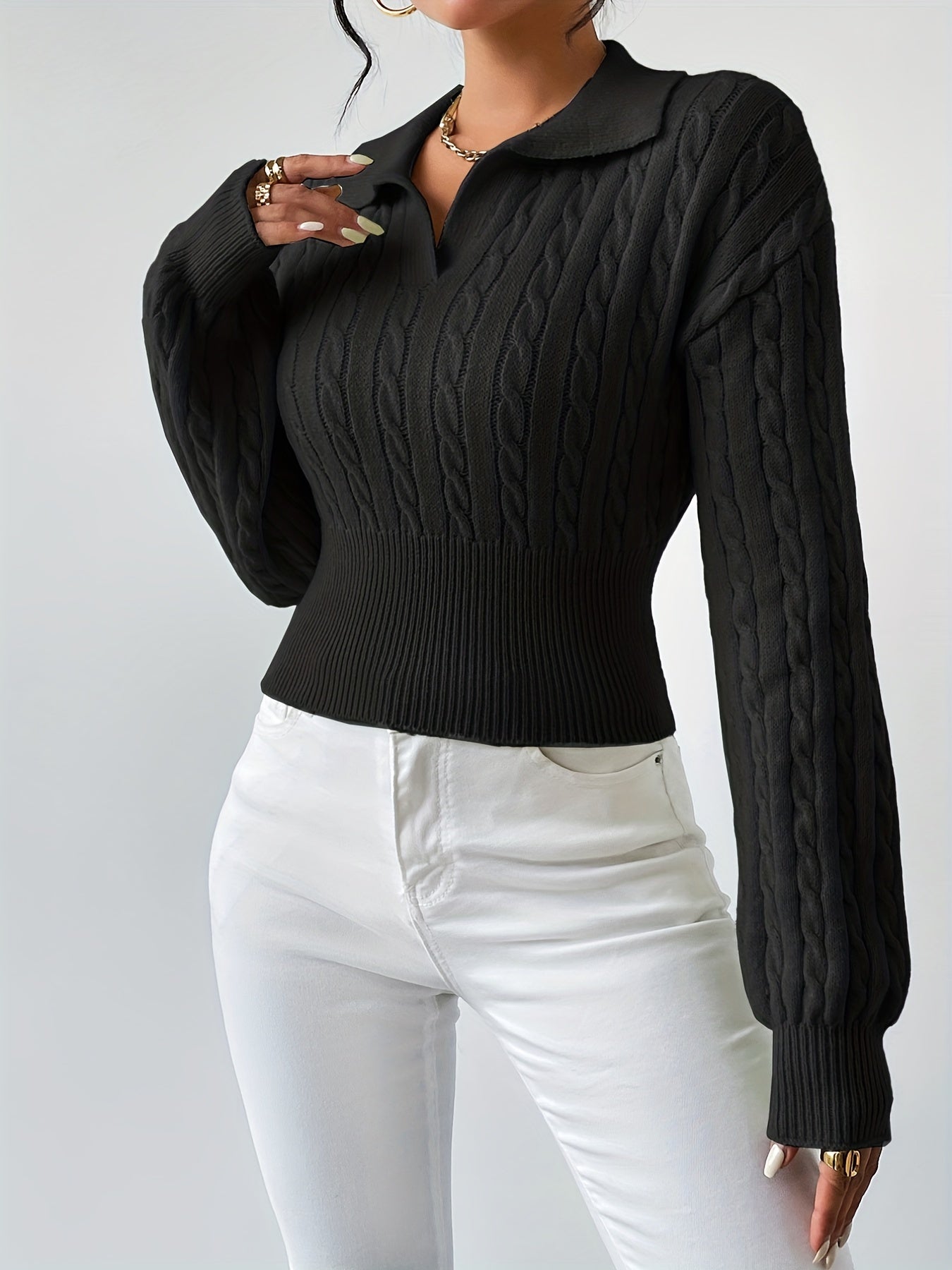 Knitted sweater with a twisted structured V-neck