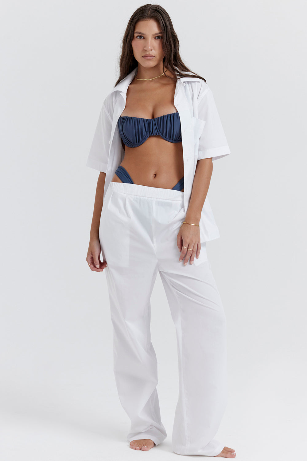 White oversized shirt with relaxed fit trousers