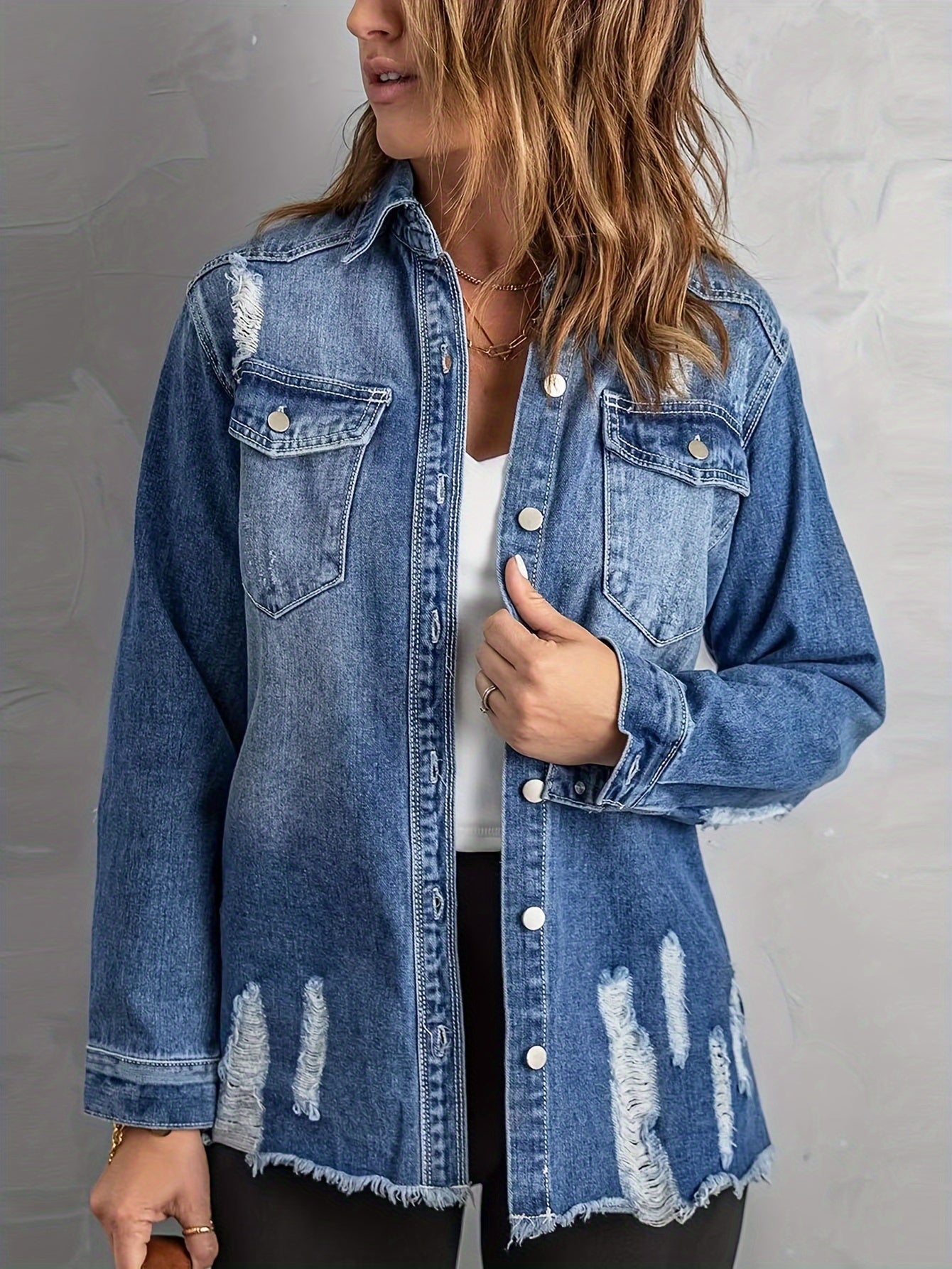 Denim jacket with ripped holes on the lapels