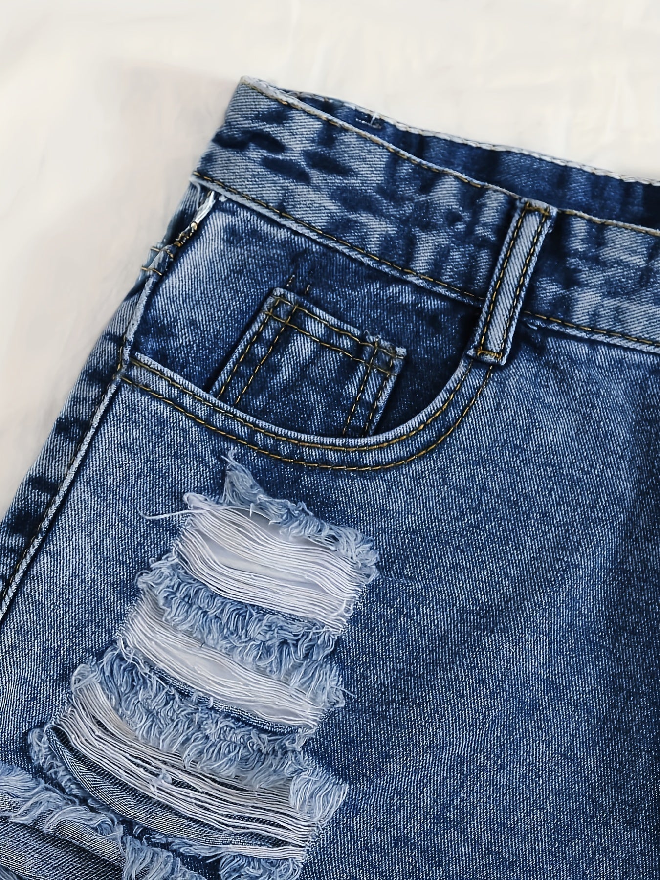 Sky blue denim shorts with frayed hem and tears