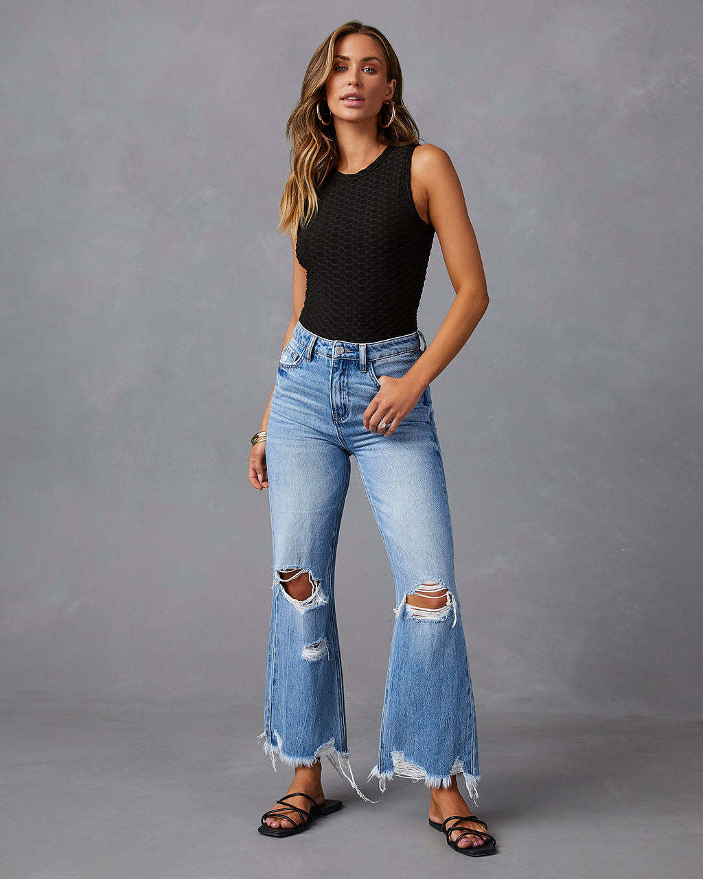 Ripped jeans with high waist and wide legs