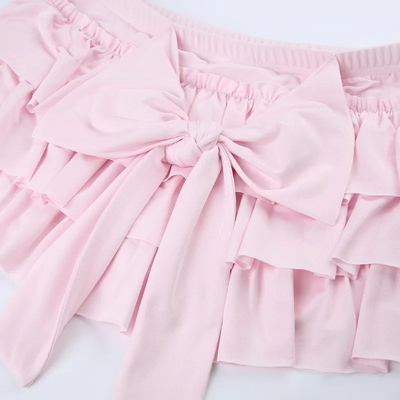 Bow Hip Mini Skirt In Light Pink