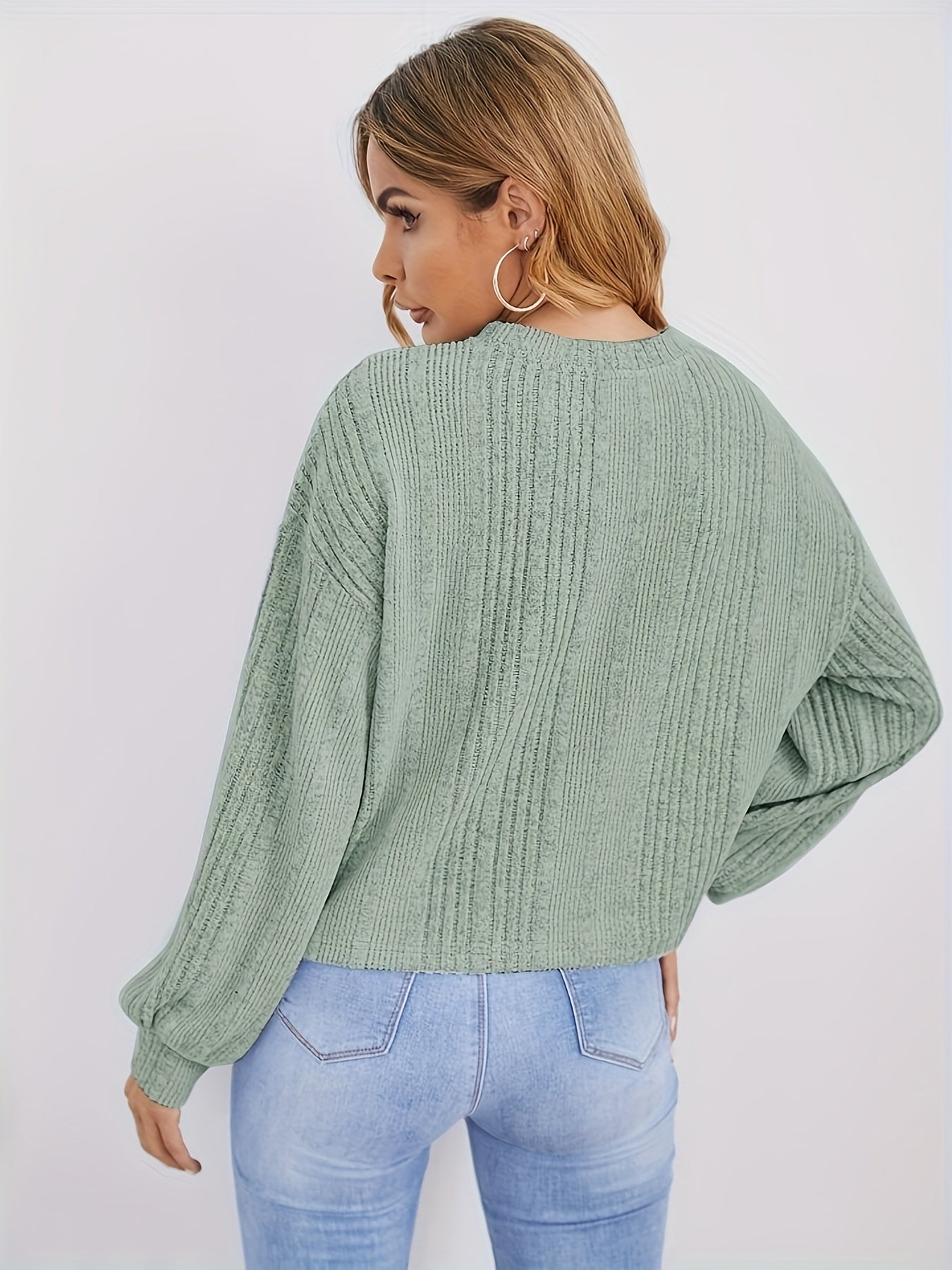 Ribbed sweater with round neck and pearl decoration