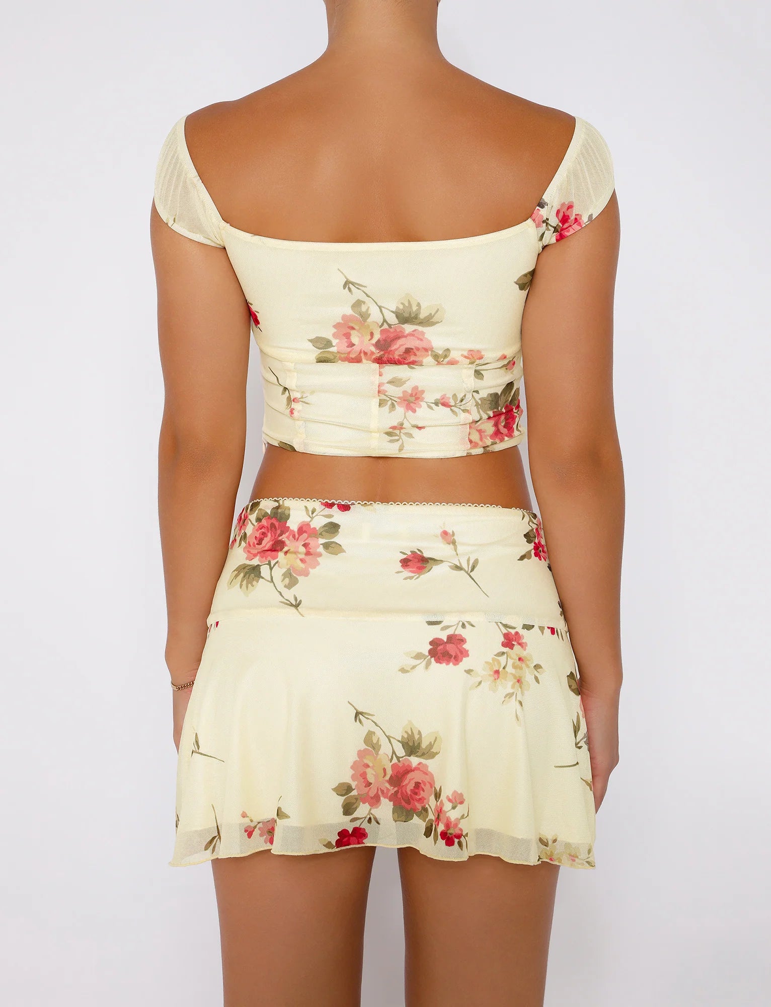 Sleeveless crop floral top with wrap mini skirt