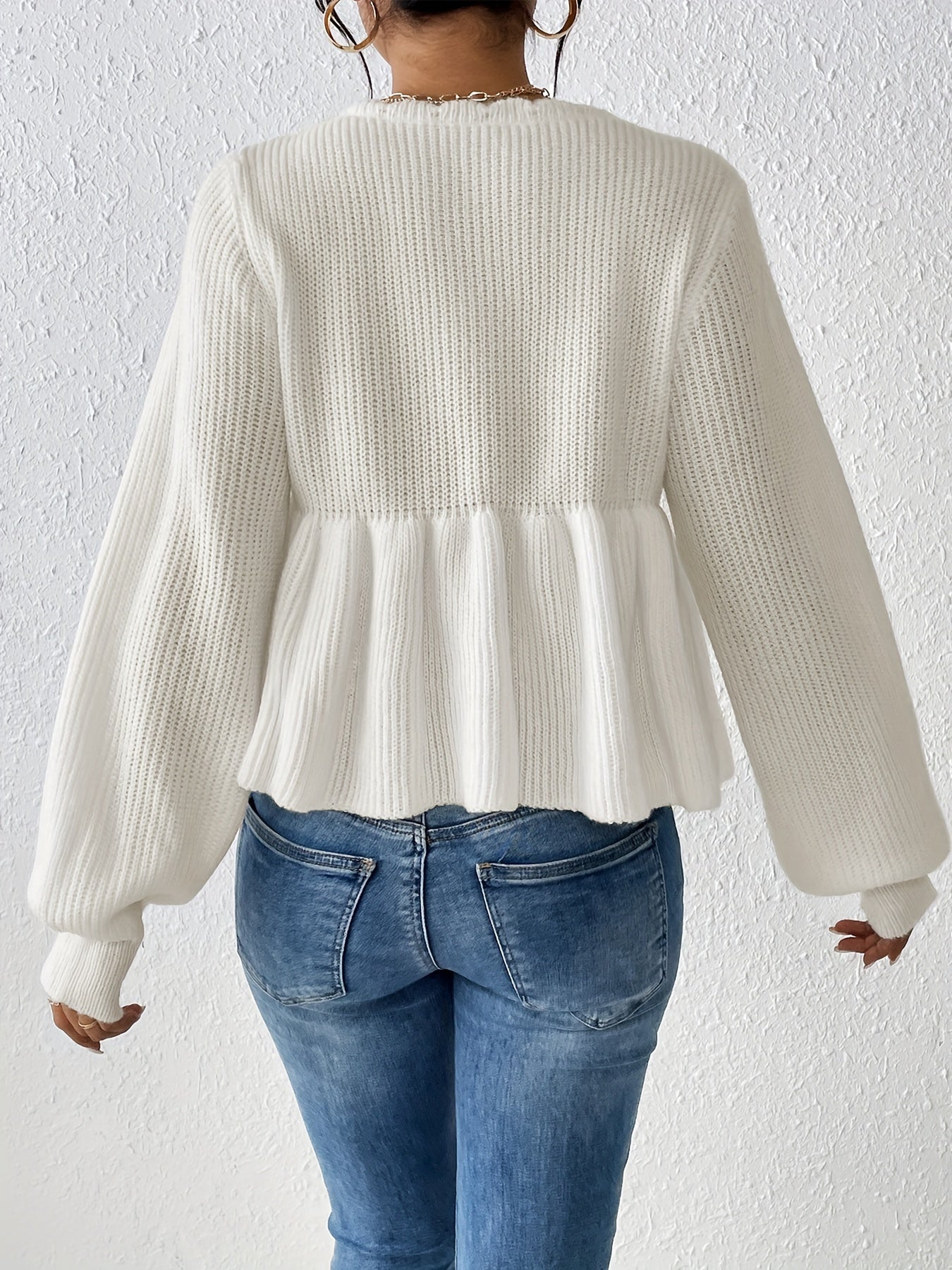 White sweater with drawstring ruffles at the hem