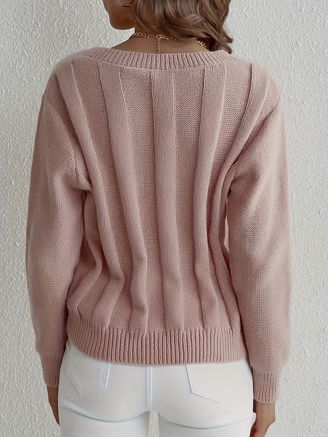 Knitted sweater with V-neck