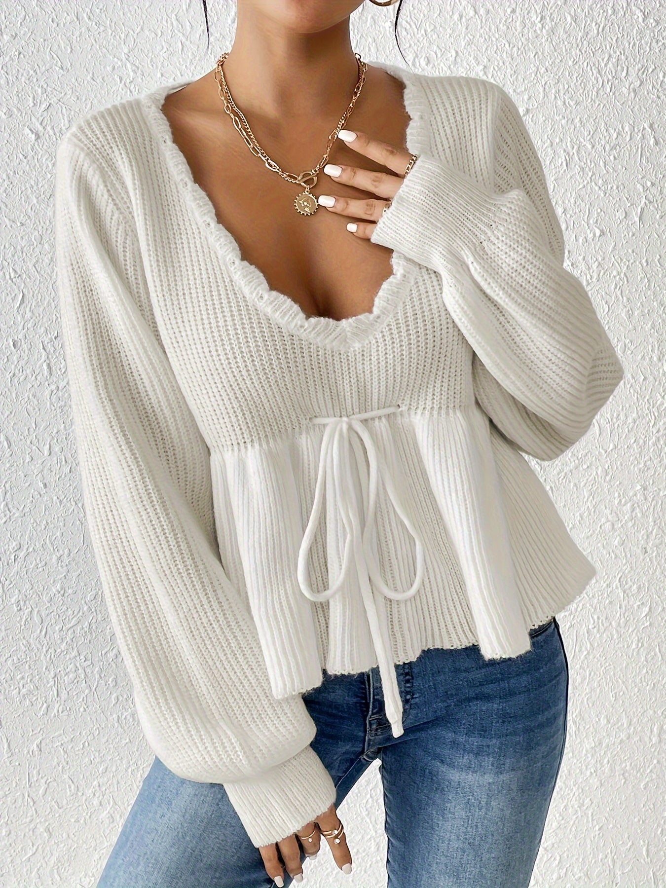 White sweater with drawstring ruffles at the hem