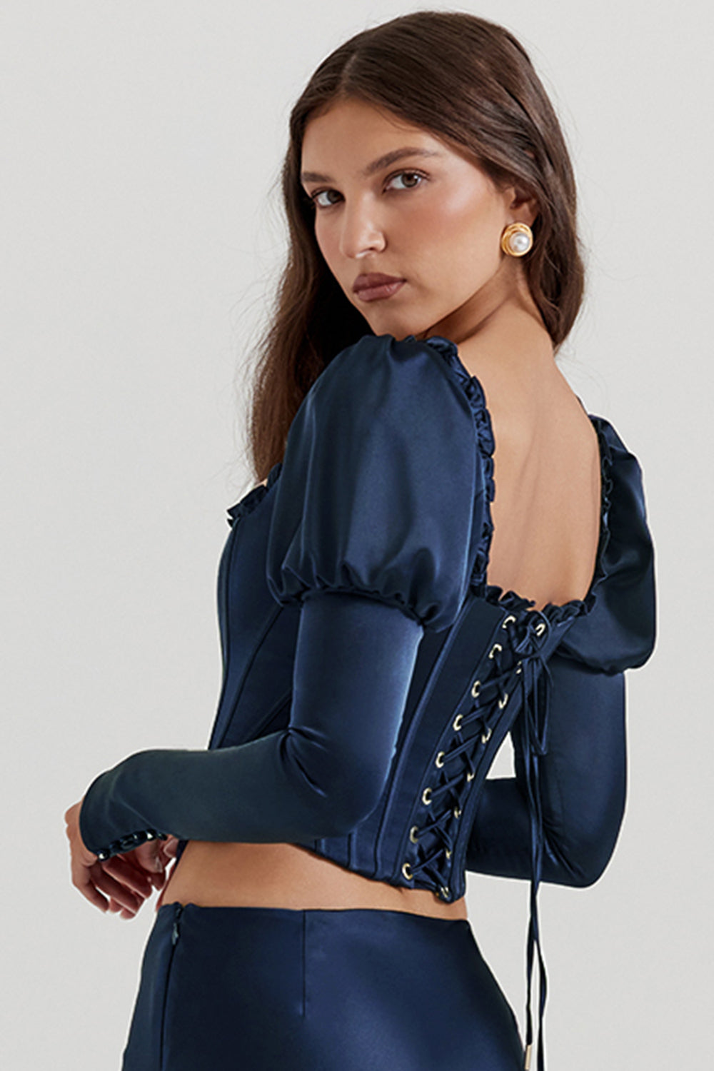 Navy blue corset with puff sleeves and satin maxi skirt with bias cut