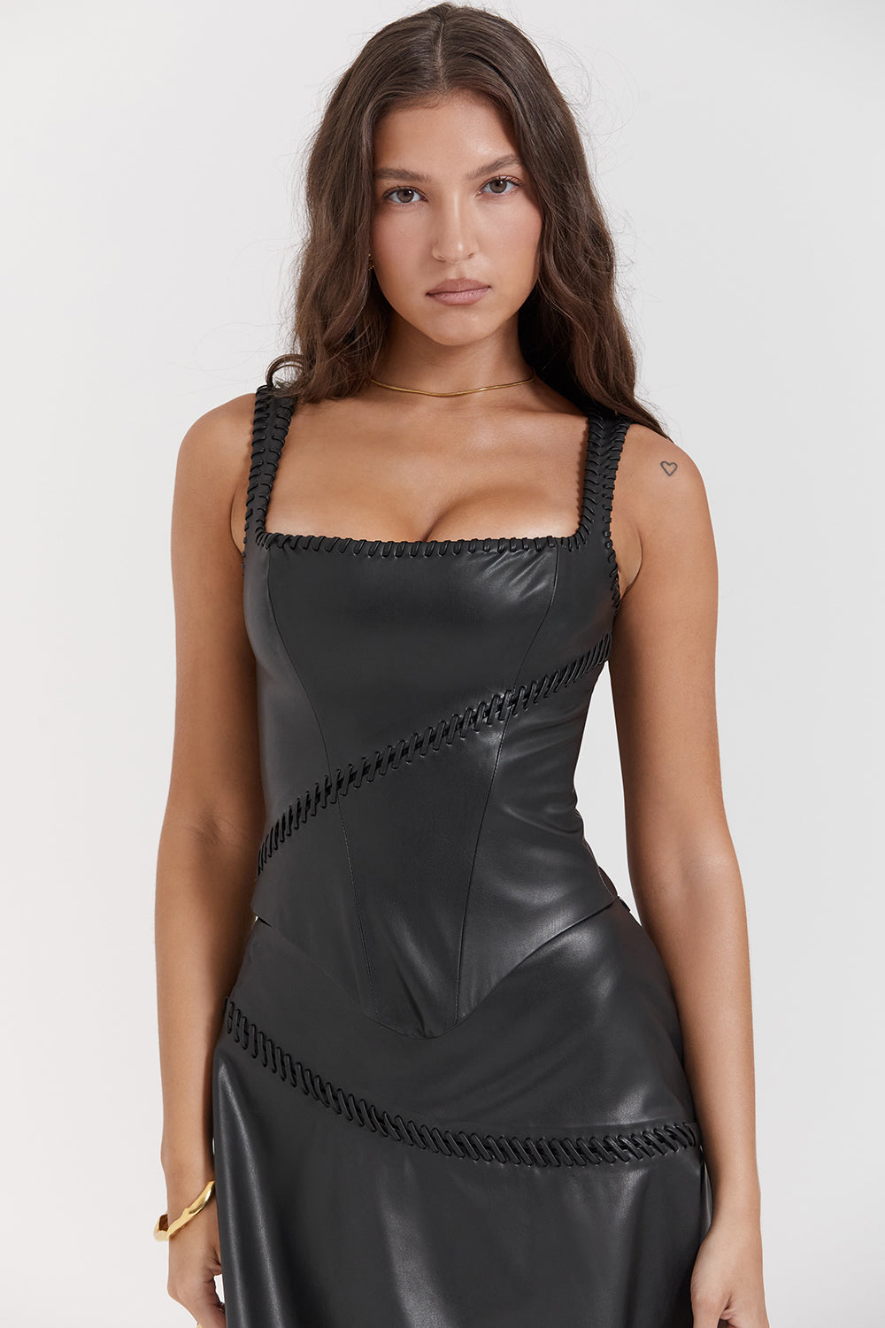 Black vegan leather corset with mini skirt