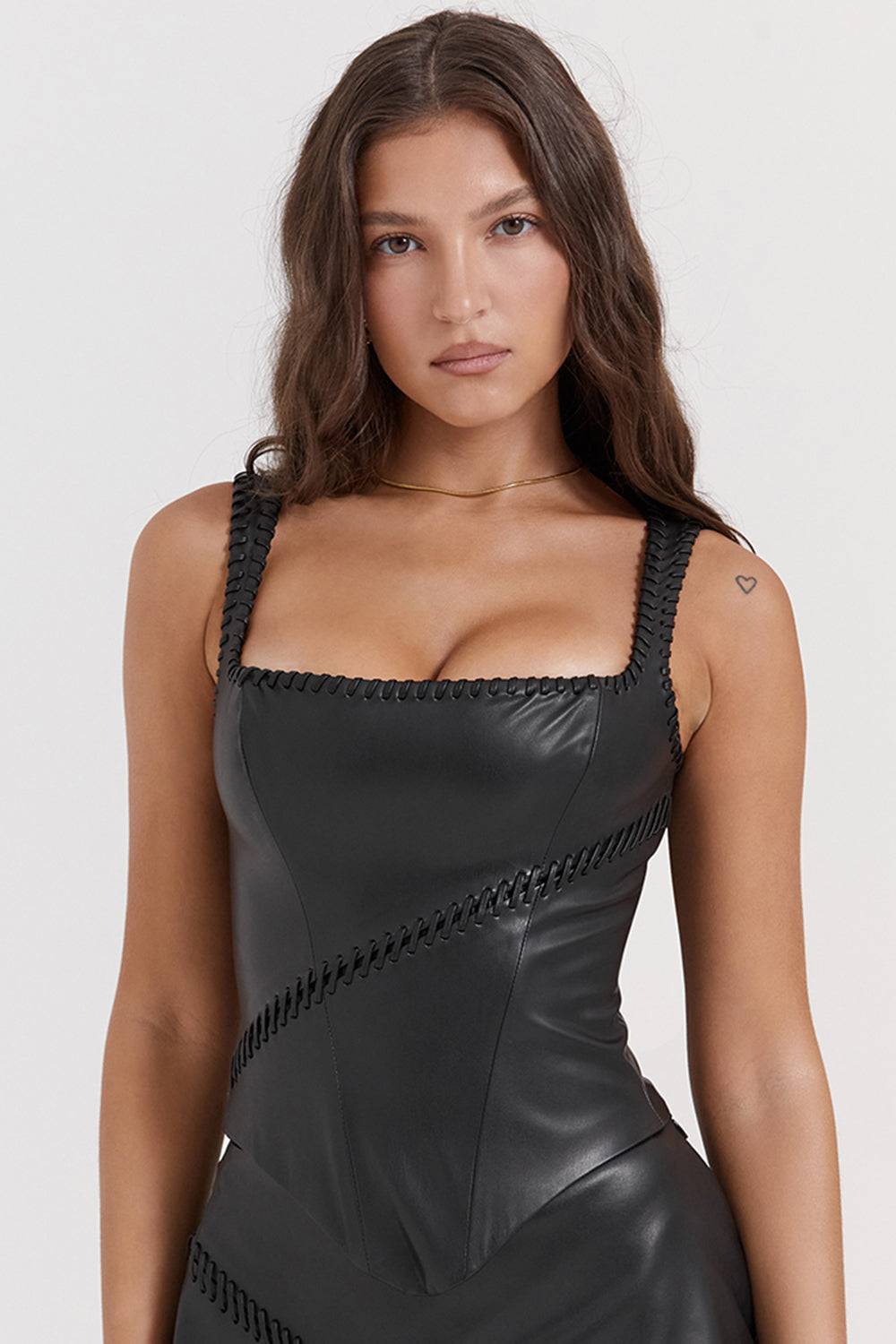 Black vegan leather corset with mini skirt