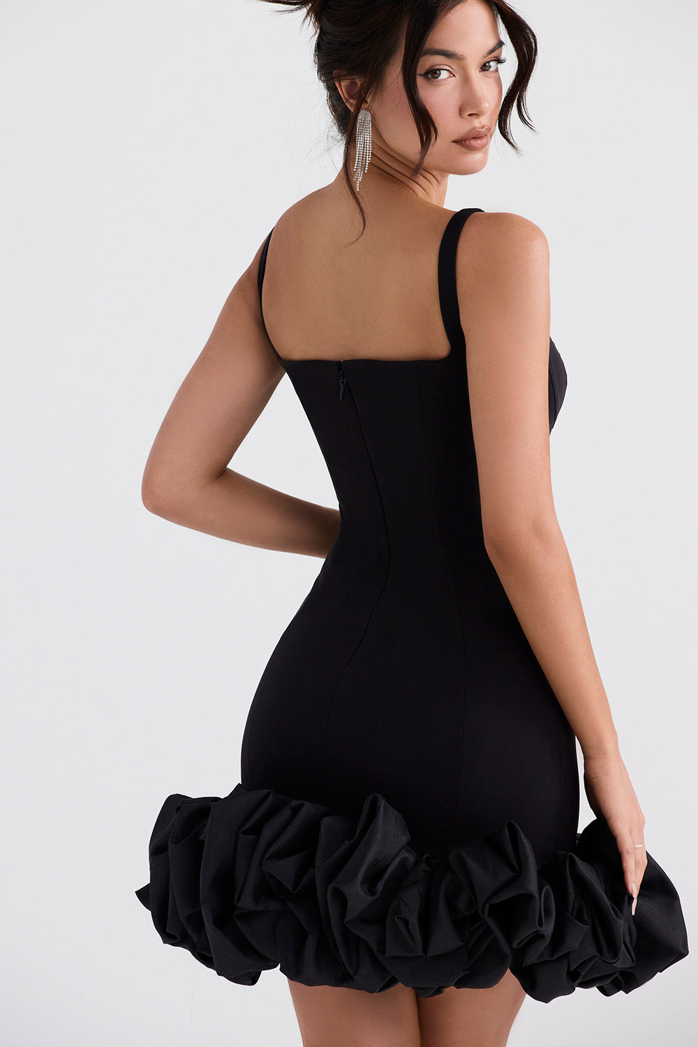 Black dress with ruffles at the hem