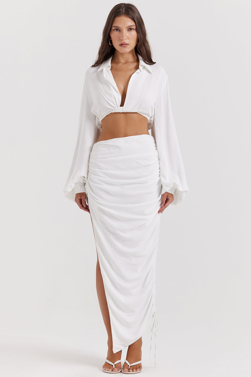 White deep blouson top with pleated maxi skirt