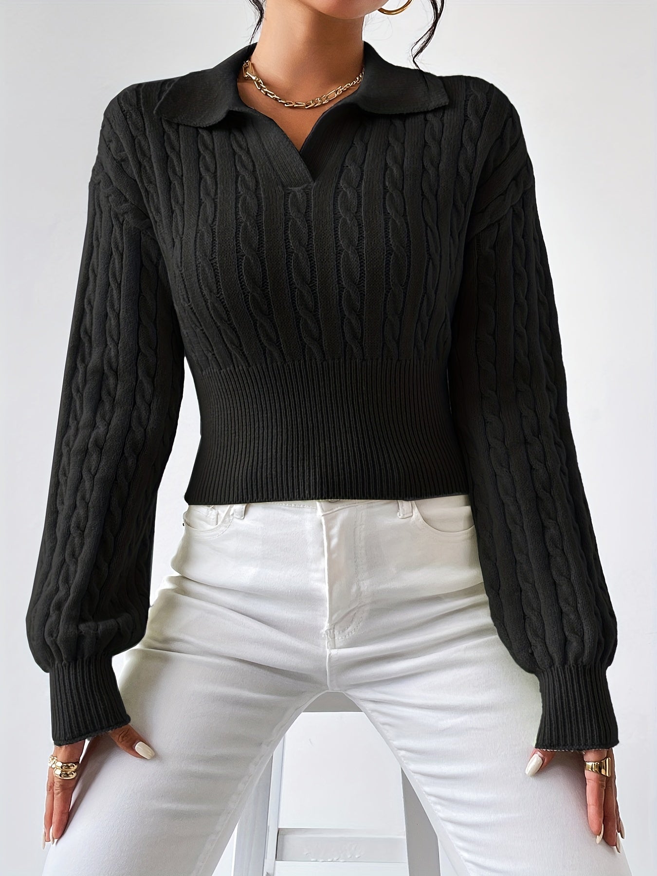 Knitted sweater with a twisted structured V-neck