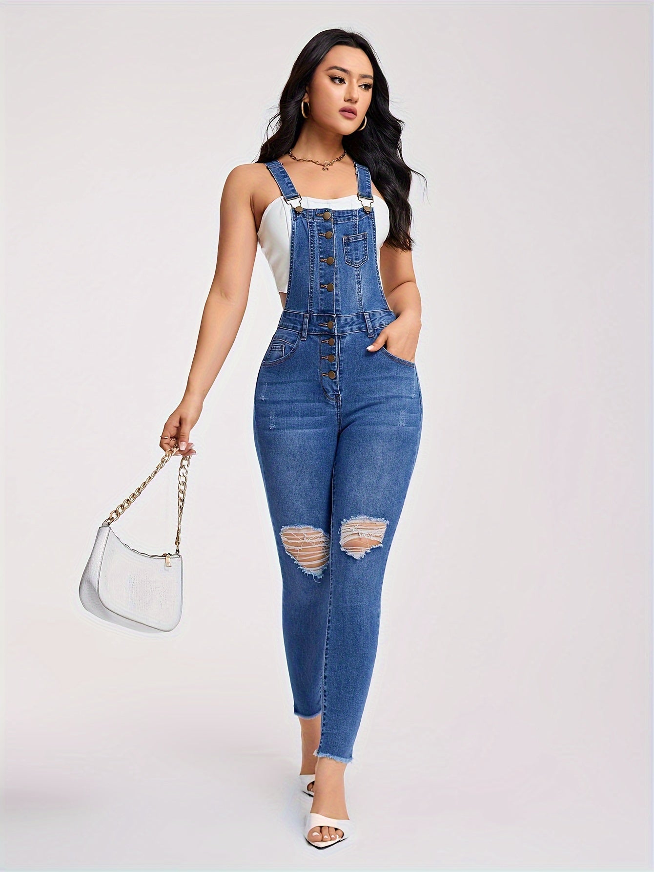 Torn denim overalls with half buttons