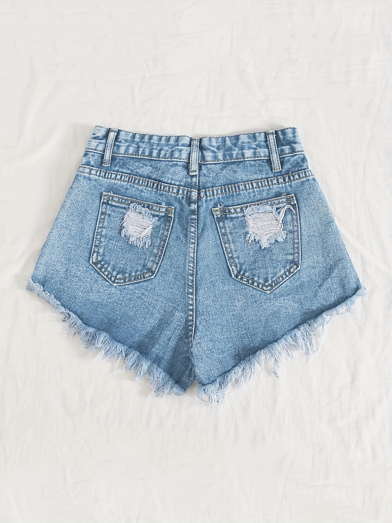 Sky blue denim shorts with frayed hem and tears