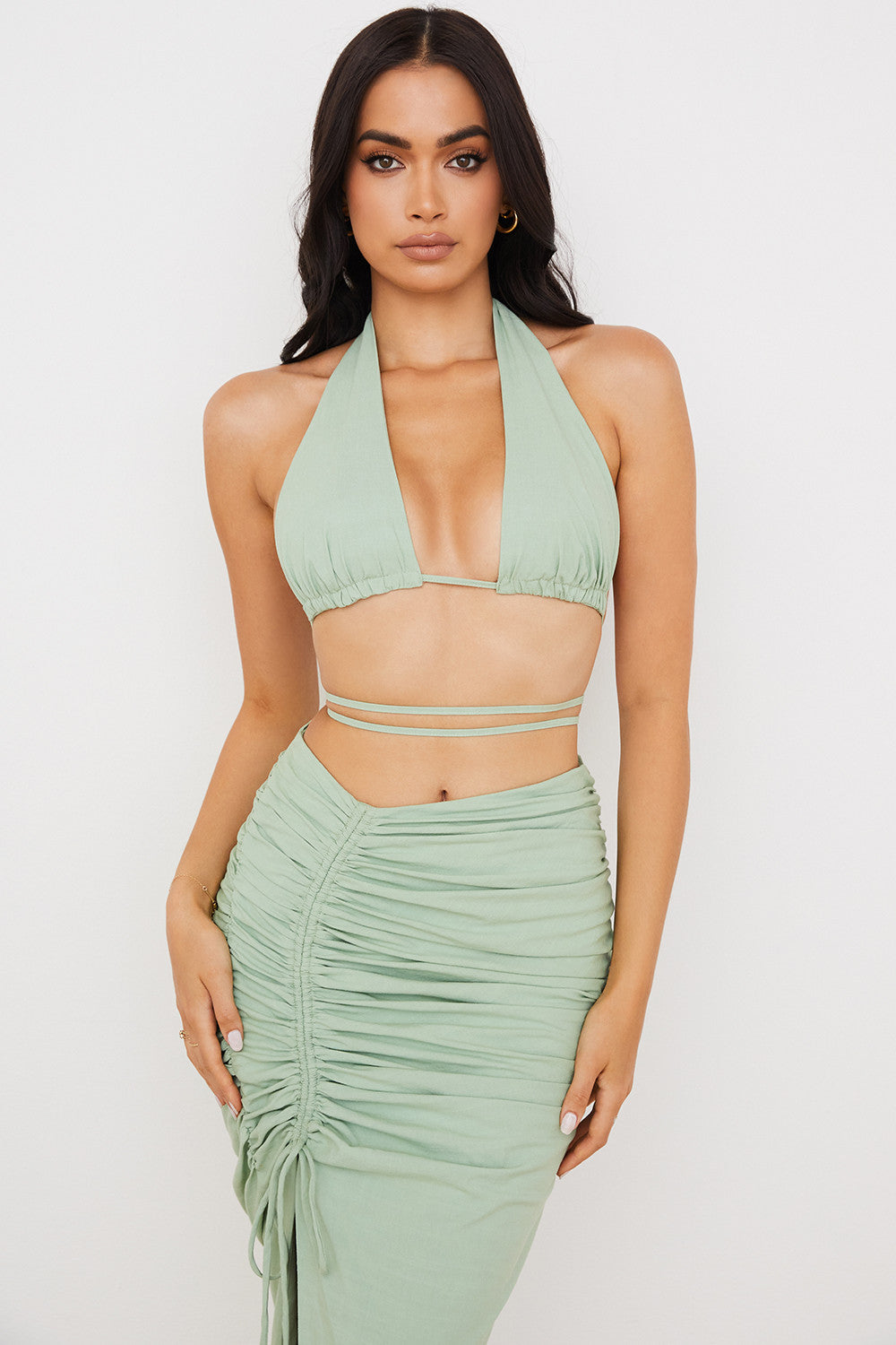 Sage colored bustier top with halter neck and maxi skirt with drawstring