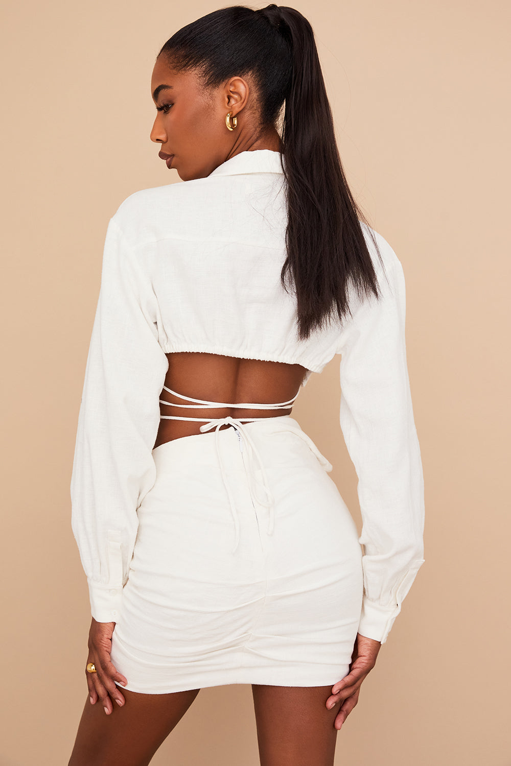 Off-white cropped wrap shirt with folded waist mini skirt