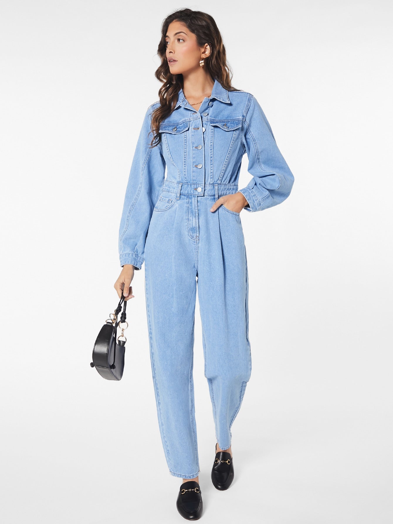 Blues jumpsuit with flap pocket made of denim with button closure at the front