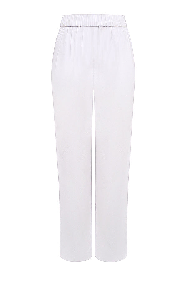 White oversized shirt with relaxed fit trousers