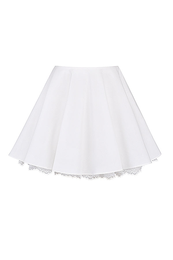 White top with puff sleeves and mini skirt with bow