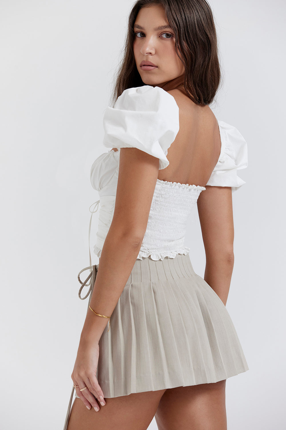 White pleated top with Stone pleated mini wrap skirt