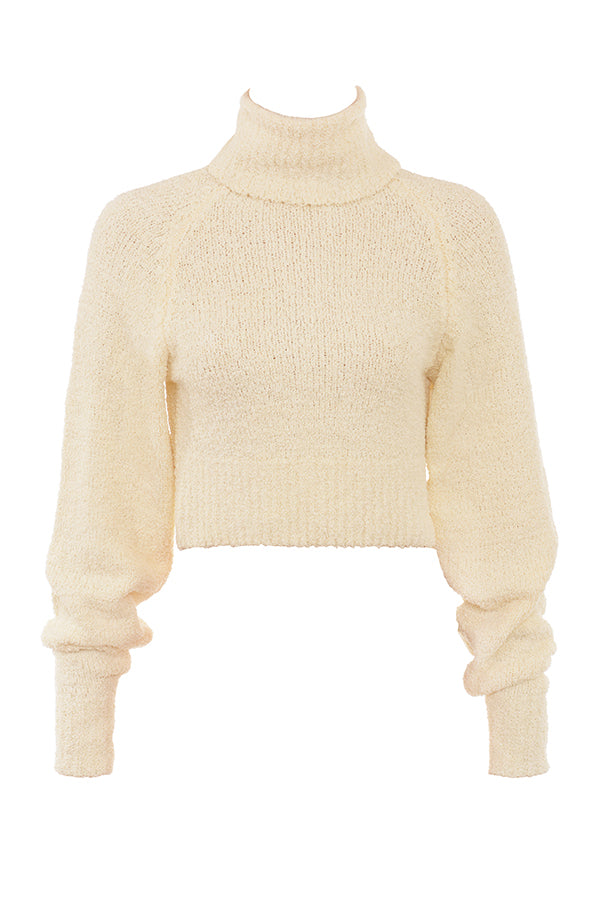 Cream-colored soft boucléknitted cropped sweater with midi skirt