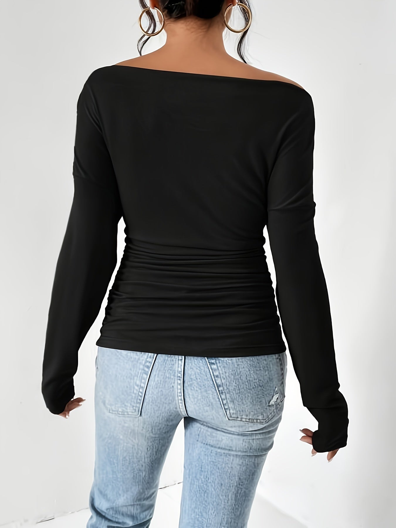 T-shirt with asymmetrical neckline and ruffles