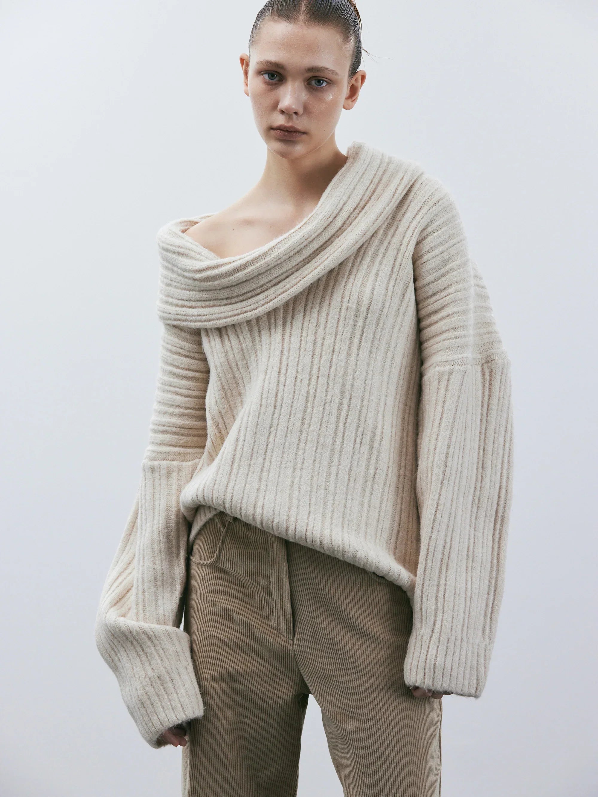 Oversized knitted sweater with high roll