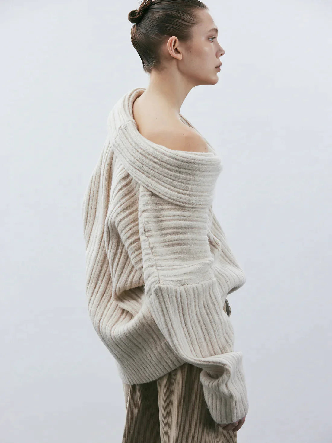 Oversized knitted sweater with high roll