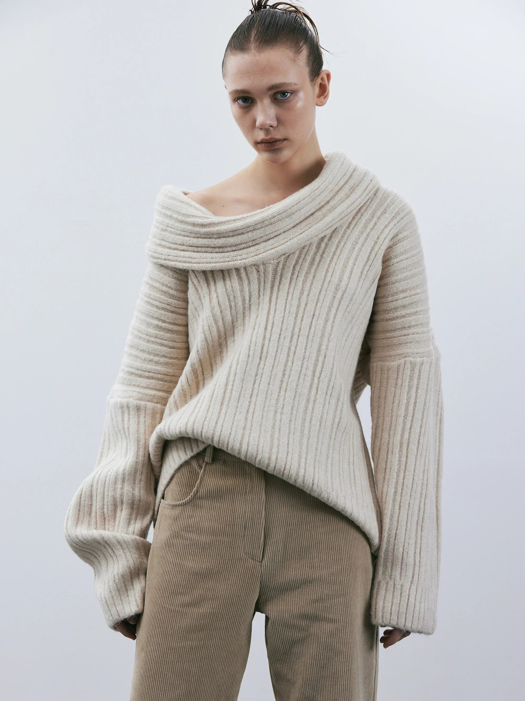 Oversized knitted sweater with high roll