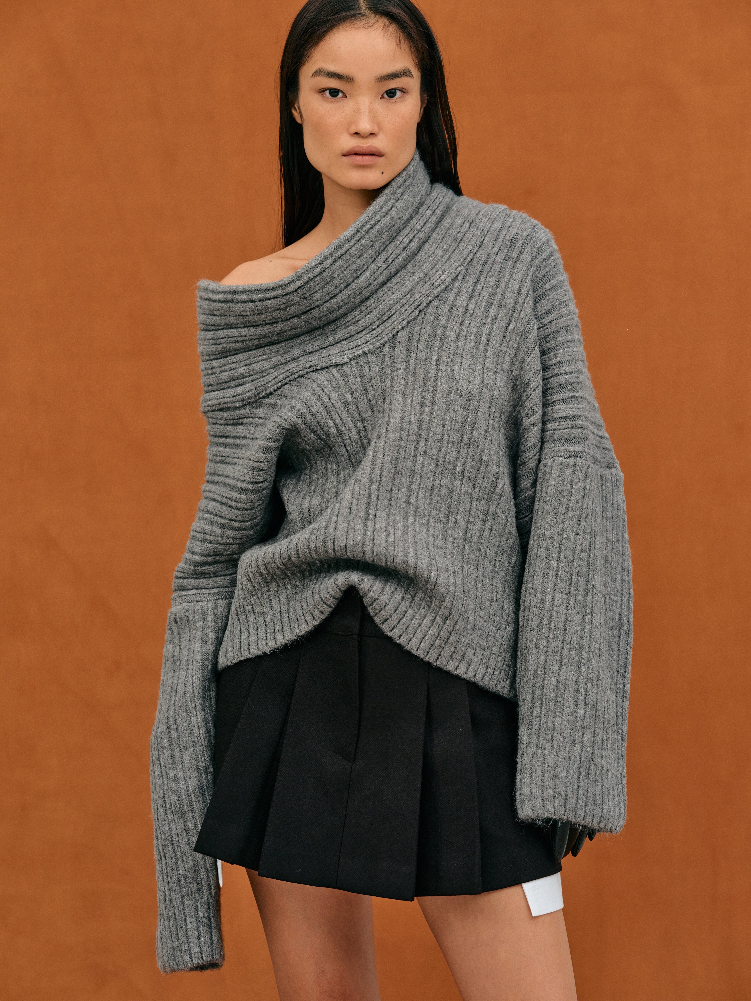 Oversized knitted sweater with high roll