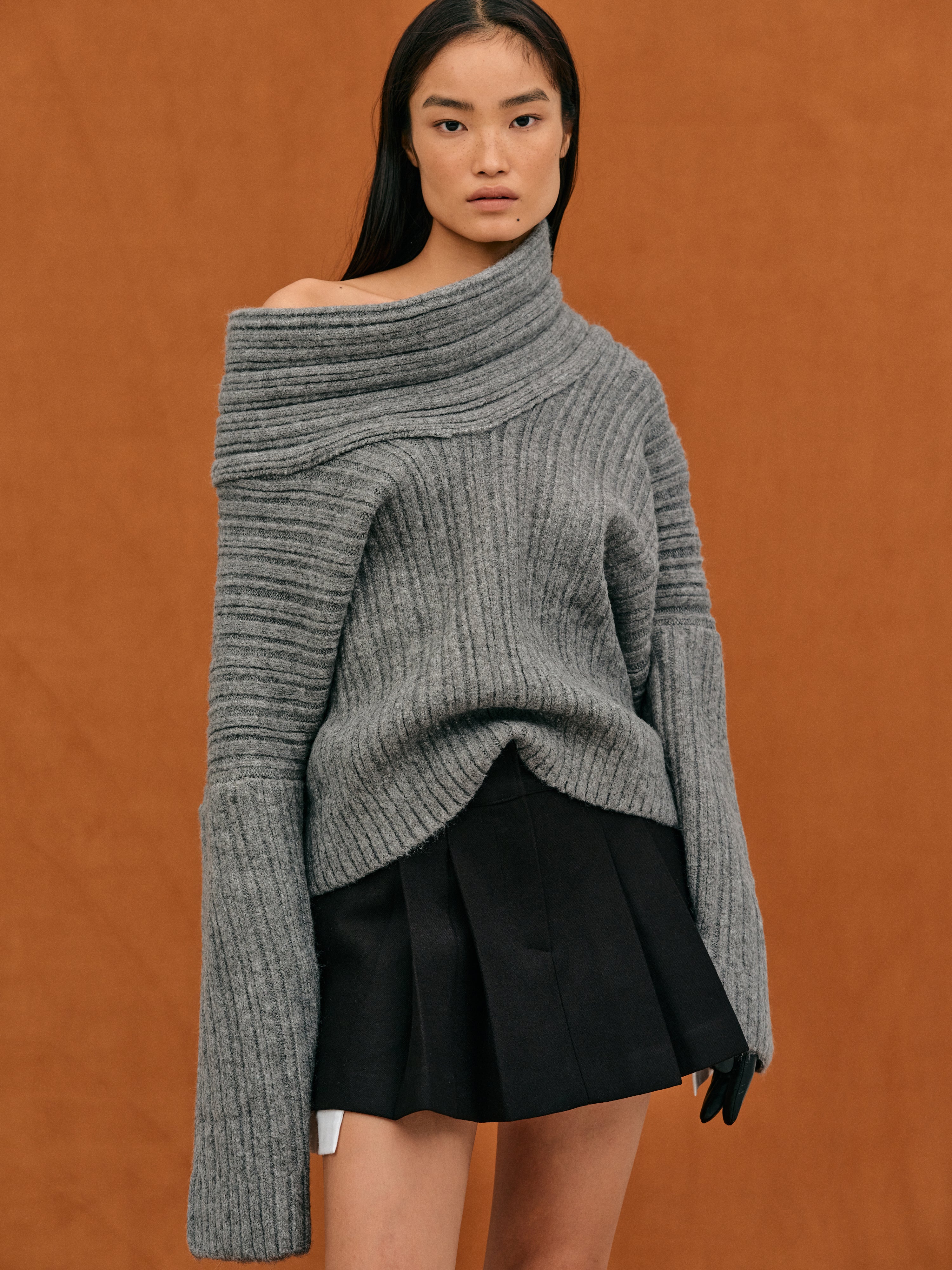 Oversized knitted sweater with high roll