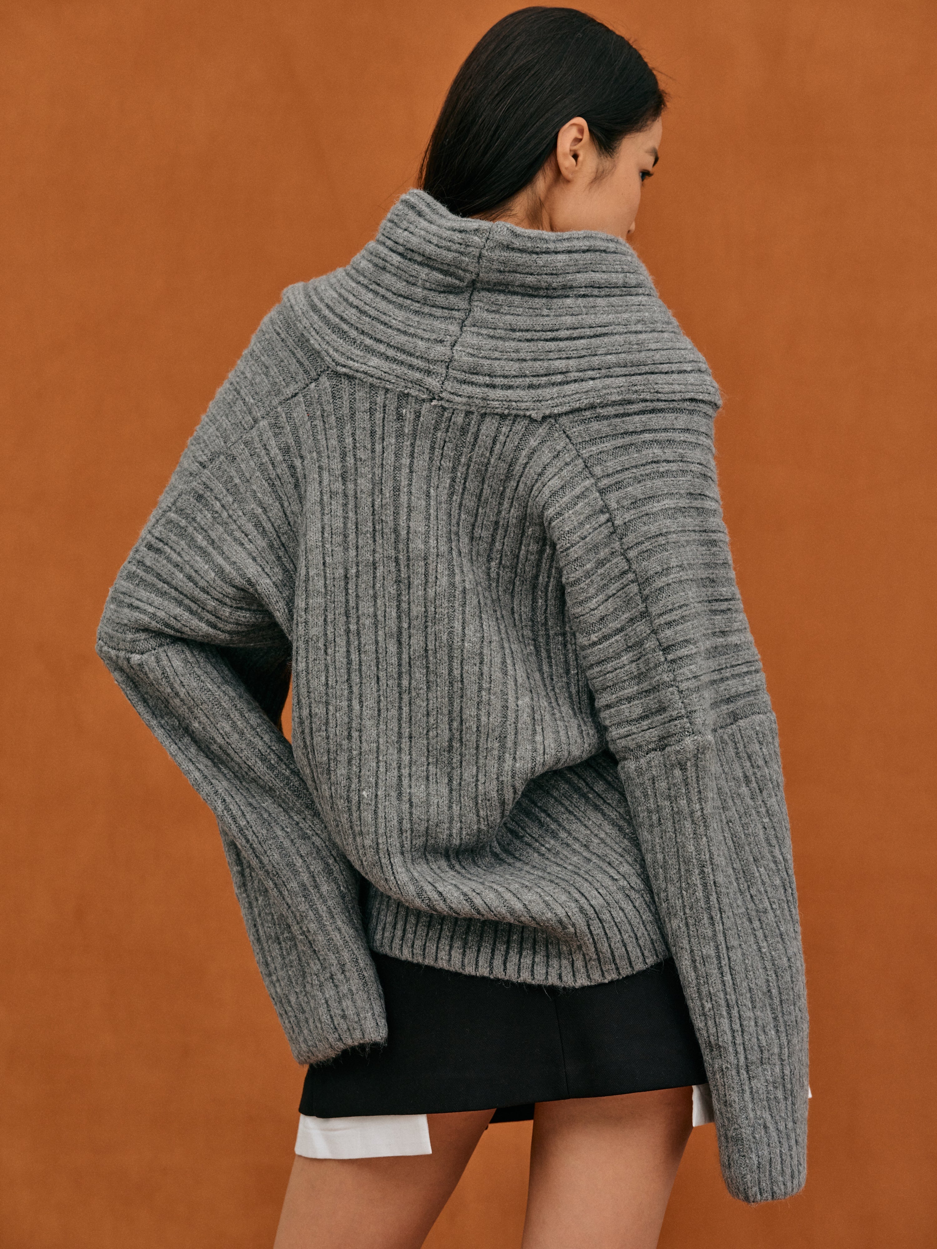 Oversized knitted sweater with high roll