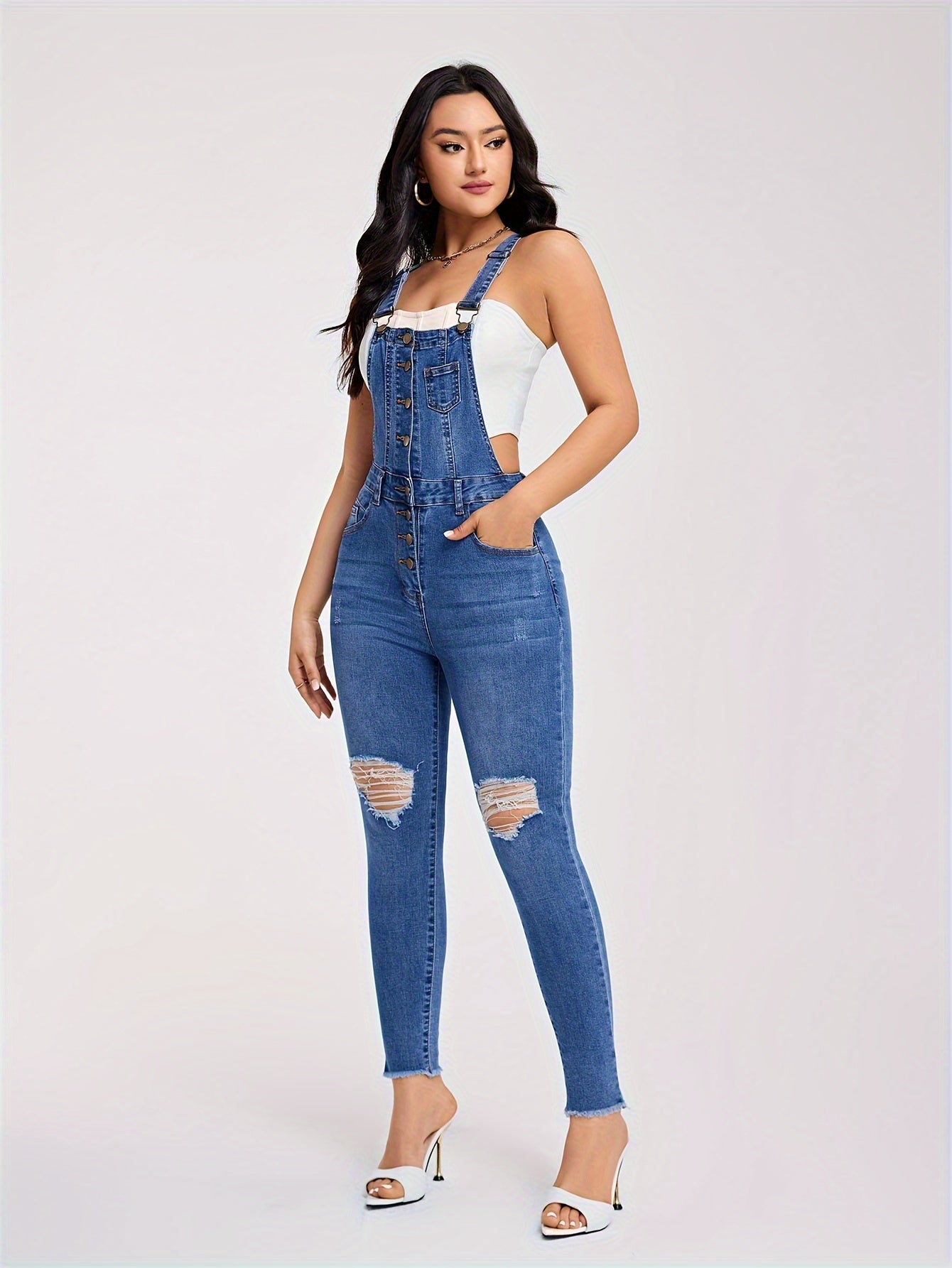 Torn denim overalls with half buttons