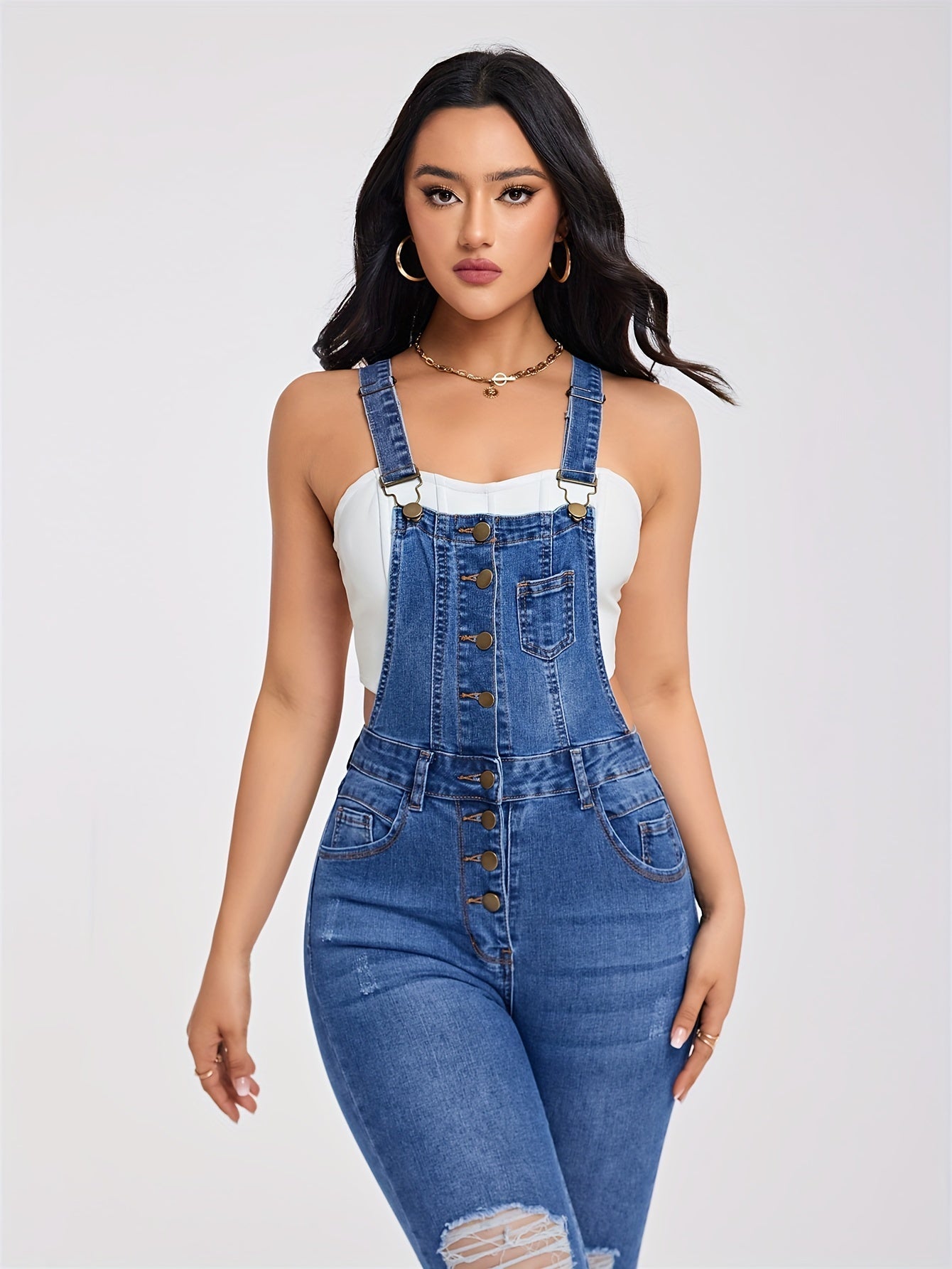 Torn denim overalls with half buttons