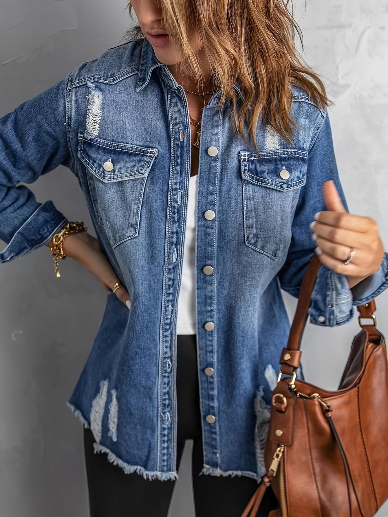 Denim jacket with ripped holes on the lapels